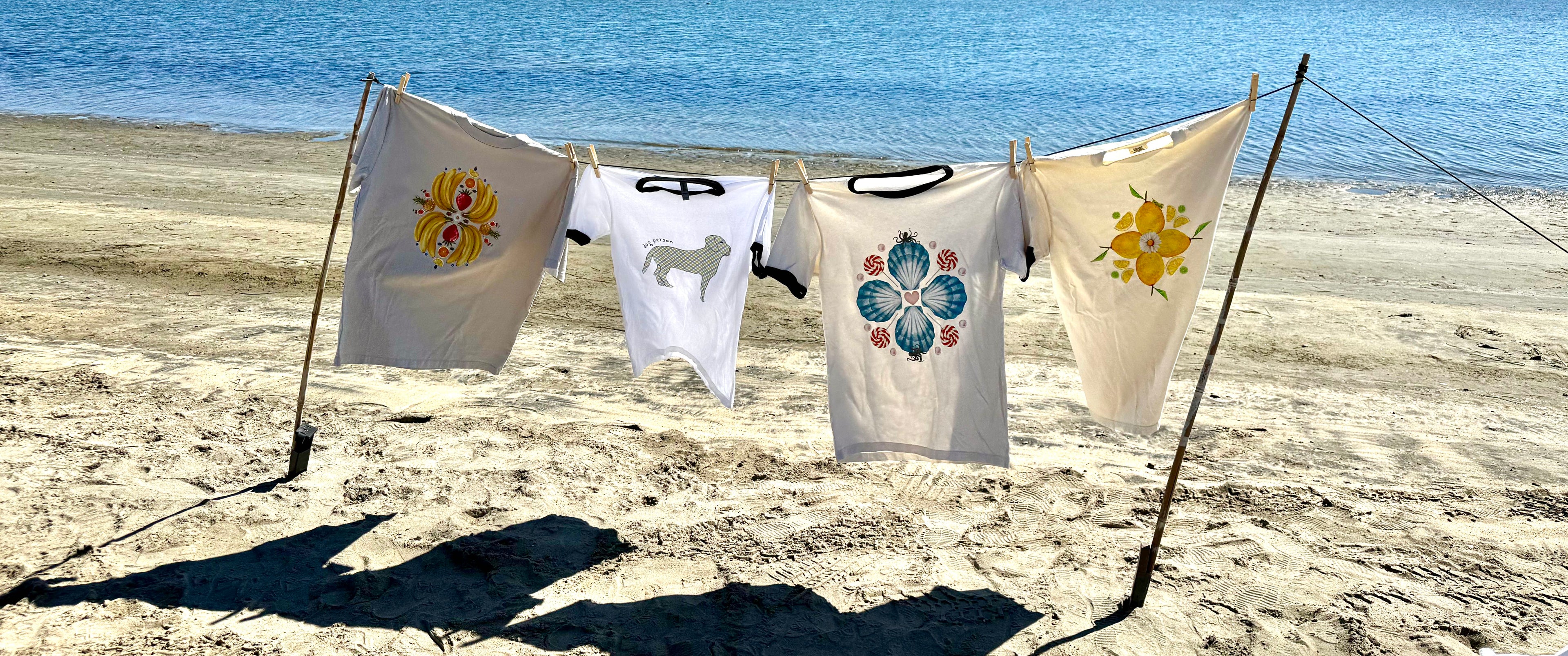 Best Selling Tee Shirts blowing in the wind on the beach. 